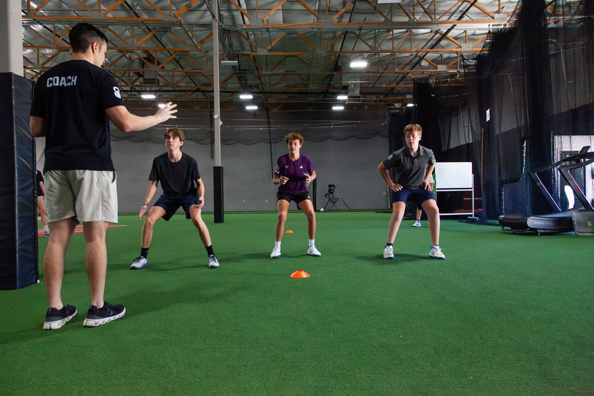 Sports training session with coach and athletes